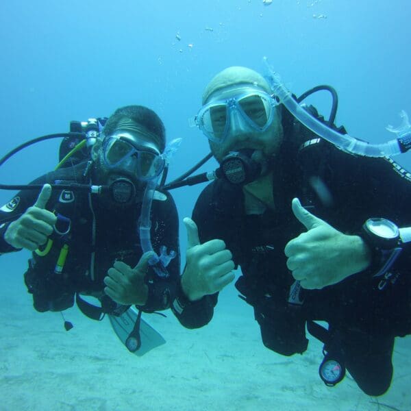 Certified diver celebrating PADI Open Water completion