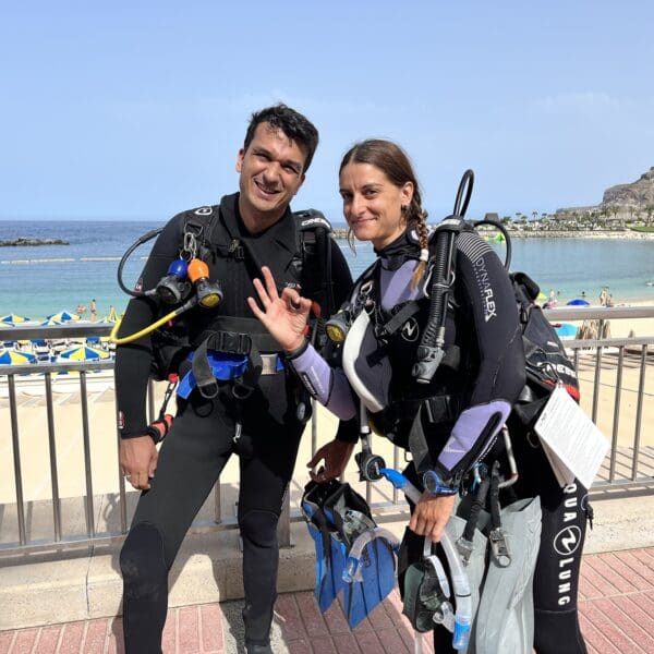 Group of open water students with instructor at the surface